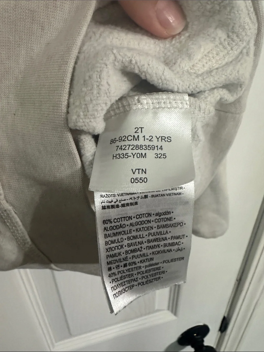 Nike Kids Beige Hoodie with Black Logo and White Swoosh